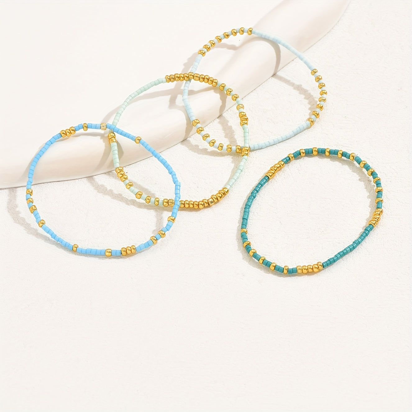4pcs Elegant Beaded Bracelet Set - Handcrafted with Delicate Mini Beads, Stretchable for Comfort, Perfect Hand Jewelry for Women