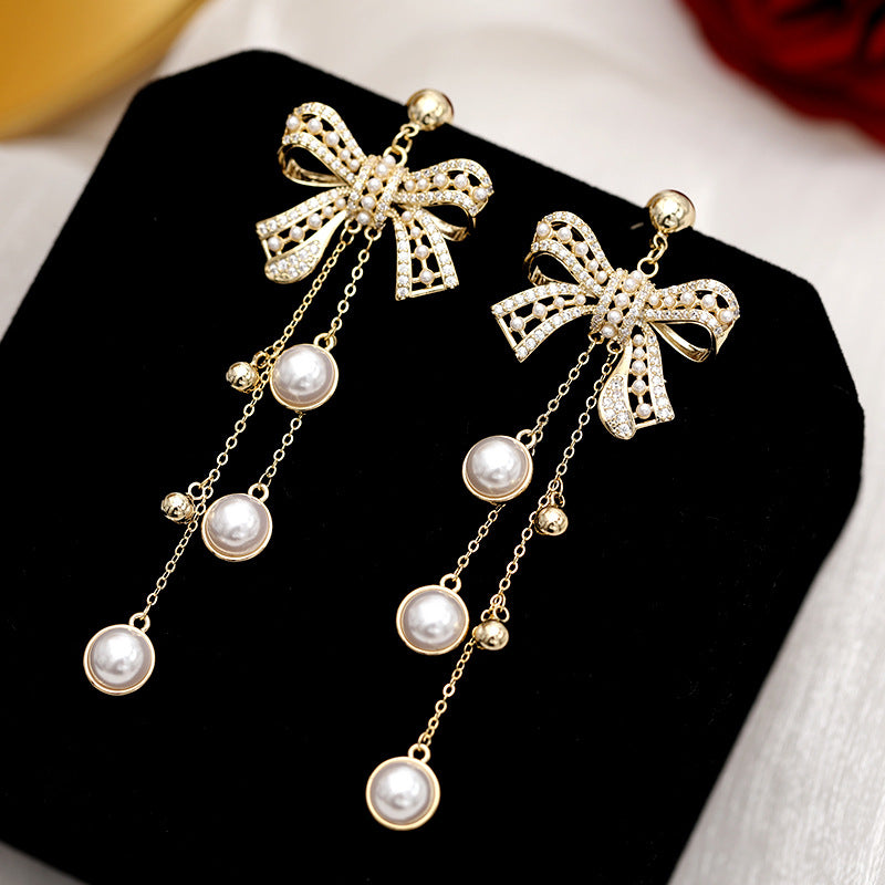 2025 earrings heavy industry retro baroque pearl silver needle earrings bow long fringed earrings women