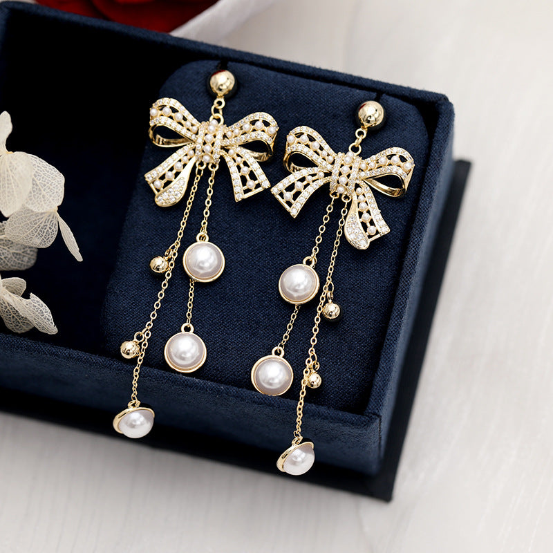 2025 earrings heavy industry retro baroque pearl silver needle earrings bow long fringed earrings women