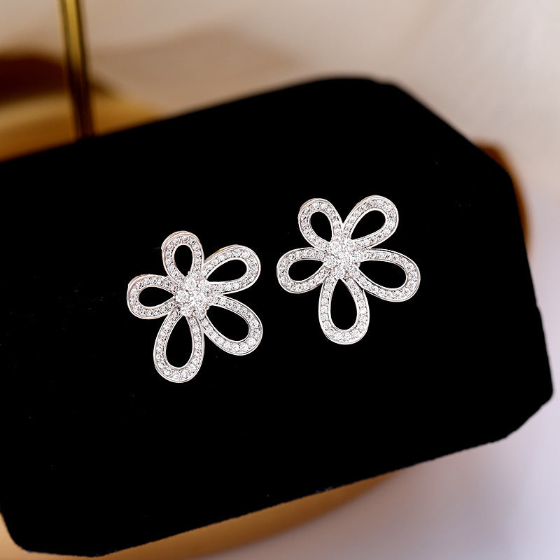 2025 Korean version of personalized jewelry simple micro inlaid zirconium sunflower earrings 925 silver needle hollow three-dimensional flower stud earrings
