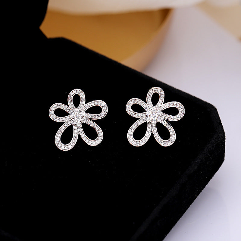 2025 Korean version of personalized jewelry simple micro inlaid zirconium sunflower earrings 925 silver needle hollow three-dimensional flower stud earrings