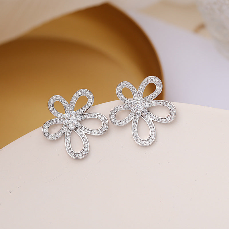 2025 Korean version of personalized jewelry simple micro inlaid zirconium sunflower earrings 925 silver needle hollow three-dimensional flower stud earrings