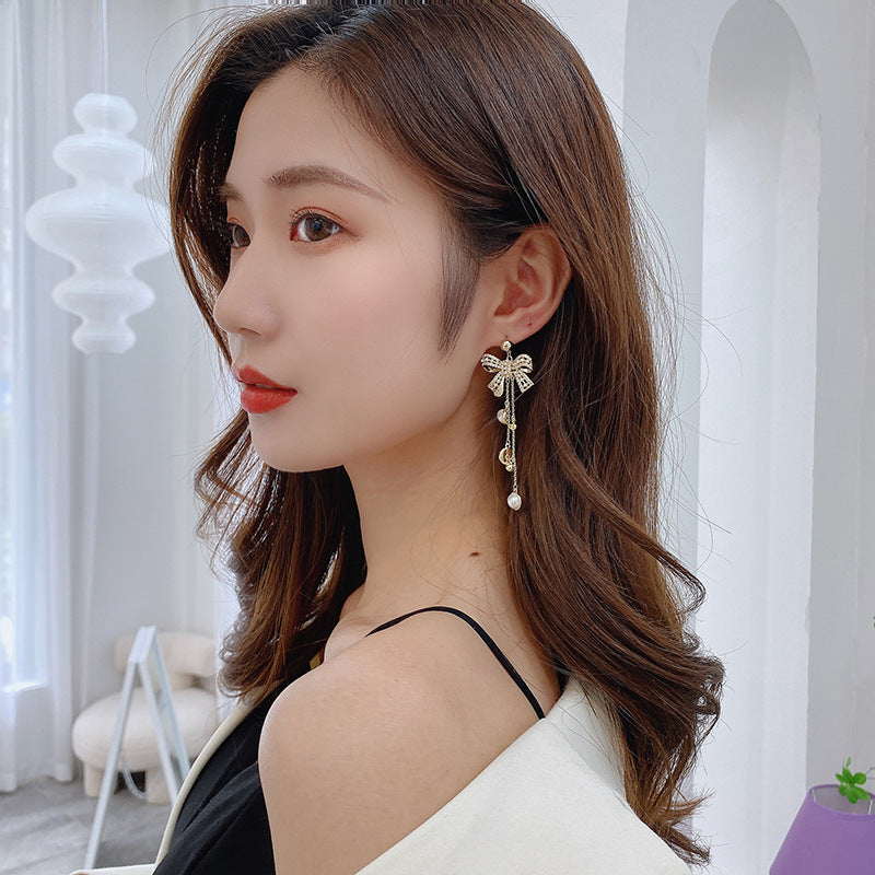 2025 earrings heavy industry retro baroque pearl silver needle earrings bow long fringed earrings women