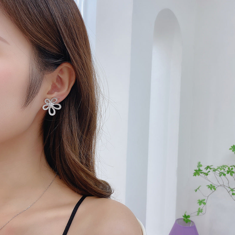 2025 Korean version of personalized jewelry simple micro inlaid zirconium sunflower earrings 925 silver needle hollow three-dimensional flower stud earrings