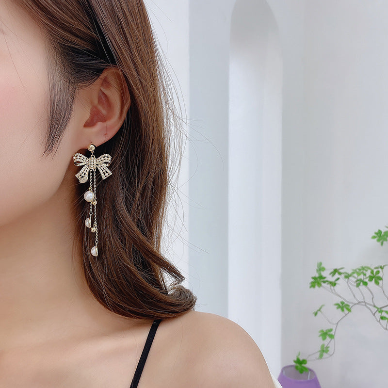 2025 earrings heavy industry retro baroque pearl silver needle earrings bow long fringed earrings women
