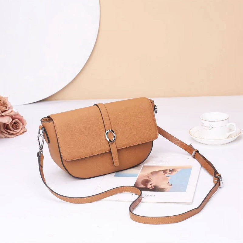 Street trend leather women's bag fashion saddle bag niche high sense TOGO pattern cowhide shoulder messenger bag 9810