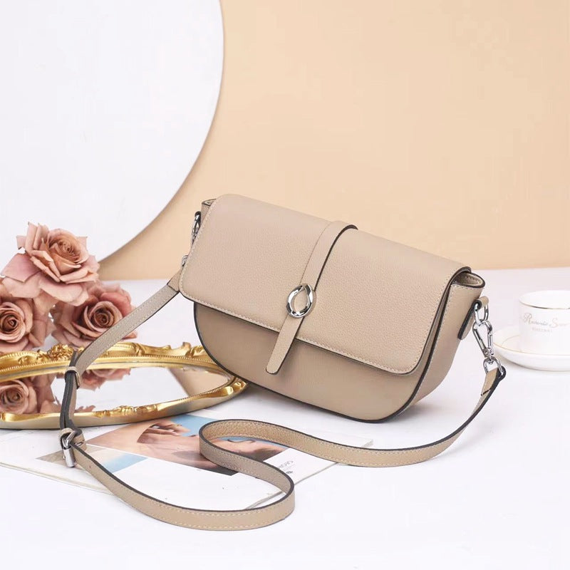 Street trend leather women's bag fashion saddle bag niche high sense TOGO pattern cowhide shoulder messenger bag 9810