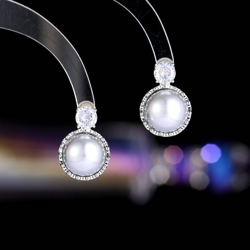 2025 Simple, fashionable and versatile temperament earrings, exquisite niche amber trendy girl earrings s925 silver needle round pearl stud earrings