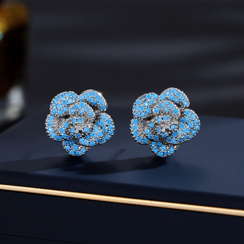 2025 Niche design high-end micro-inlaid zirconium flower earrings fashionable commuting elegant flower three-dimensional camellia stud earrings