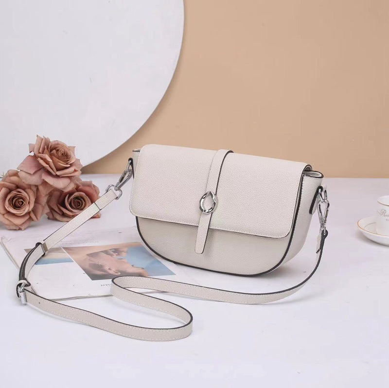 Street trend leather women's bag fashion saddle bag niche high sense TOGO pattern cowhide shoulder messenger bag 9810