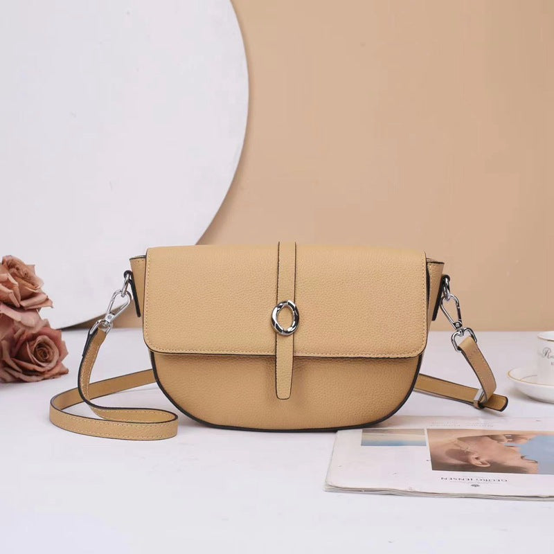 Street trend leather women's bag fashion saddle bag niche high sense TOGO pattern cowhide shoulder messenger bag 9810