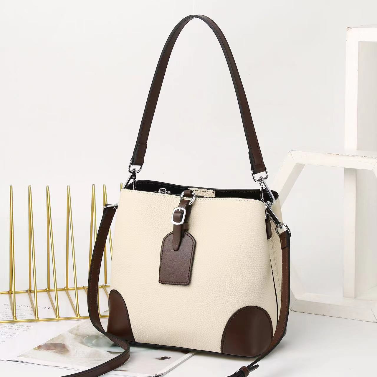 Contrasting color bucket bag  new commuter leather women's bag fashion high sense versatile shoulder messenger bag bag bag 9816