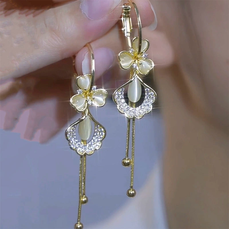 Flowers bloom, wealth, fashion and high-end opal ginkgo biloba earrings s925 silver needle long tassel face thin earrings