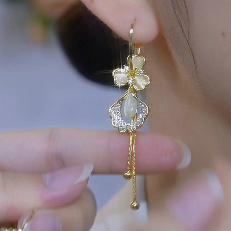 Flowers bloom, wealth, fashion and high-end opal ginkgo biloba earrings s925 silver needle long tassel face thin earrings